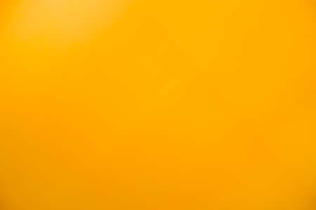 Plain Yellow background on the tableの写真素材