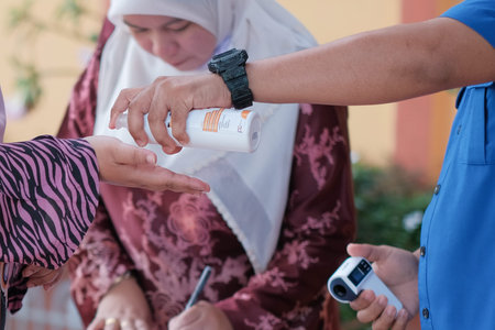 Muadzam Shah, Malaysia - June 29th, 2020: New normal, Business people team using hand sanitizer,...