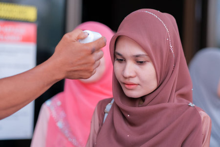 Muadzam Shah, Malaysia - July 1st, 2020: New normal, men using infrared thermometer for measuring...
