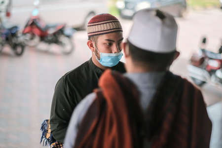 Muadzam Shah, Malaysia - July 3rd, 2020 : Muslims performed the Friday Prayer at Muadzam Shah Mosque during Covid-19 pandemic. Maintaining Social distancing guidelines.のeditorial素材