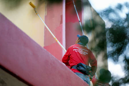 Muadzam Shah, Malaysia- July 15th, 2020 : Unrecognizable painter working painting  without Personal Protective Equipment (PPE)  . Worker concept.のeditorial素材