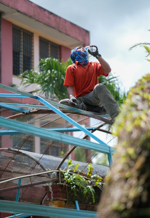 Muadzam Shah, Malaysia - July 16th,2020 : Construction workers resting, while drinking a cold water ...