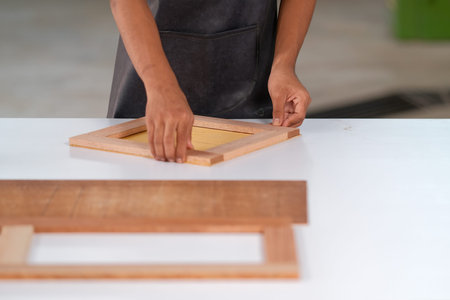 Process of gluing plank of plywood. Furniture making