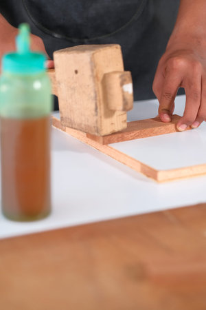 Process of gluing plank of plywood. Furniture making