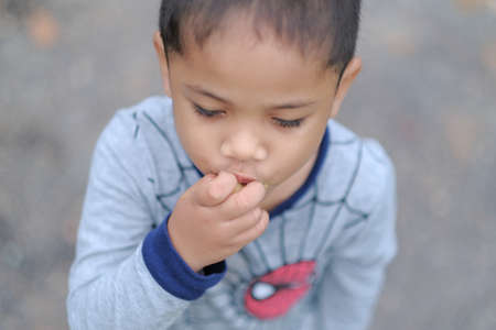 Muadzam Shah, Malaysia - September 13th, 2020 : Hiking family  having food at a  top of Ridan Hill  in Muadzam Shah, Malaysia. Family hiking on vacation.のeditorial素材
