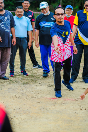 Muadzam Shah, Malaysia -   September 16th, 2020 : People playing traditional games called  marble...