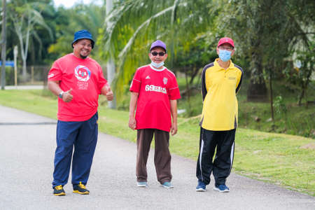 Muadzam Shah, Malaysia -   September 16th, 2020 : People walking and jogging together outdoors along a  road during Malaysia Dayのeditorial素材