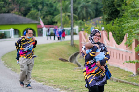 Muadzam Shah, Malaysia -   September 16th, 2020 : People walking and jogging together outdoors along a  road during Malaysia Dayのeditorial素材