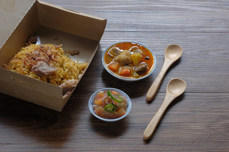 Roasted meat served with rice , dalca and sour sauce . This food is well-known in the Northern...