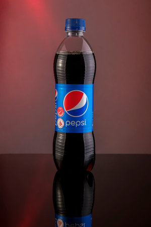 Kuala Lumpur, Malaysia - January 2nd, 2021 : Pepsi soft drink in a plastic bottle on dark background