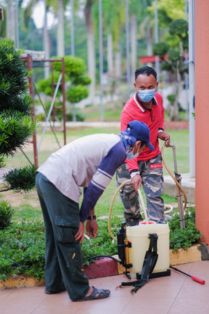 Kuala Lumpur-Malaysia - February 5th, 2021 : Disinfectant worker making disinfection in the college ...