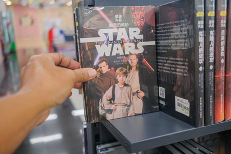 Kuantan, Malaysia - Decdmber 5th, 2020 : Hand hold a book title STAR WARS - The Force Awakens for...