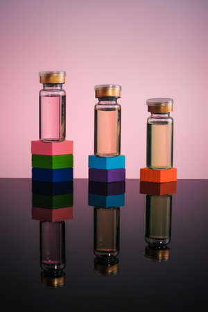 The medical concept with vaccine bottle(s) on block podium.Health competition conceptの写真素材