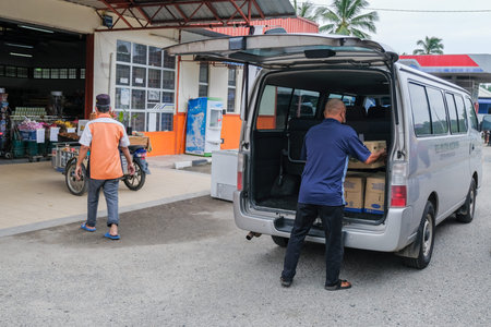 Muadzam Shah, Malaysia - July 14th, 2021 : Volunteers delivering drinking water packs to the...
