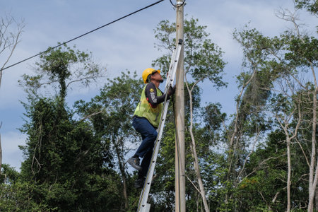 Muadzam Shah, Malaysia- September 1st, 2021 : Worker from telecomunication internet provider company working on implementation of fiber optic cables in Muadzam Shah .のeditorial素材
