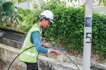 Muadzam Shah, Malaysia- September 1st, 2021 : Worker from telecomunication internet provider company...