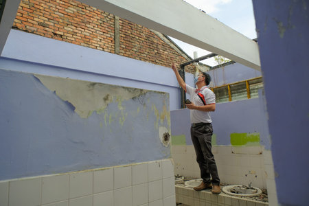Muadzam Shah, Malaysia- September 4st, 2021 :Contractor took measurements of the roofing work in the...