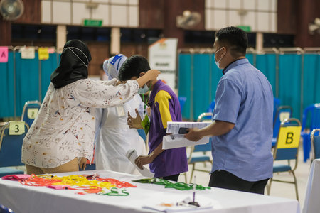 Muadzam Shah, Malaysia - September 28th, 2021: Indoor view of people wearing mask waiting queue for coronavirus covid-19 vaccinationのeditorial素材