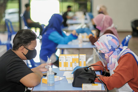 Muadzam Shah, Malaysia - October 31th, 2021 : Students make Covid-19 rapid test with saliva sample...