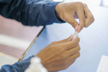 Muadzam Shah, Malaysia - October 31th, 2021 : Students made a quick Covid-19 test by placing saliva and fluid buffer observations before the school session began.のeditorial素材