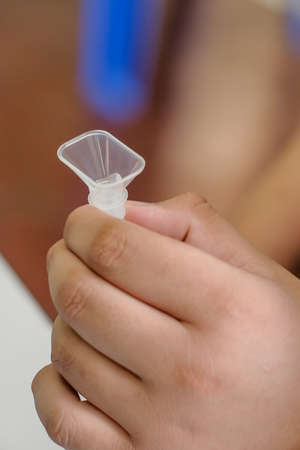 Muadzam Shah, Malaysia - October 31th, 2021 : Students made a quick Covid-19 test by placing saliva and fluid buffer observations before the school session began.のeditorial素材