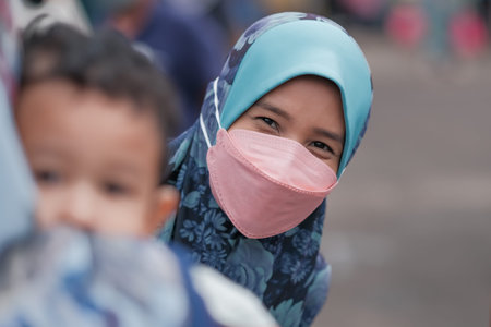 Muadzan Shah, Malaysia - April 8th, 2022:  Crowd along a stretch of stalls at a ramadhan bazaar  in...