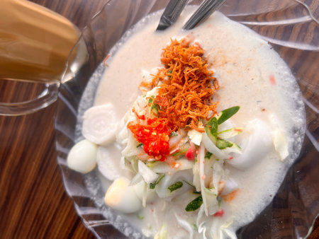 Thai spicy soup with coconut milk on wood table, Thai foodの写真素材