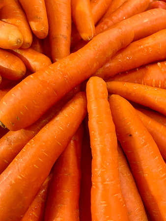 Fresh carrots for sale at a farmers market in London, UK.