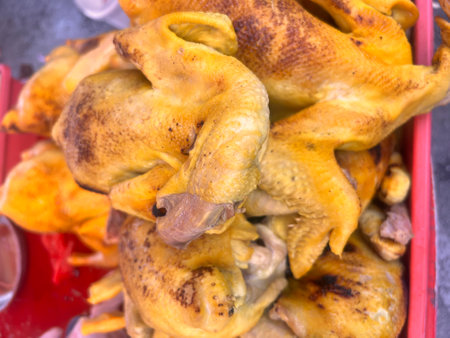 Grilled chicken on the street market in Thailand, close up.の写真素材