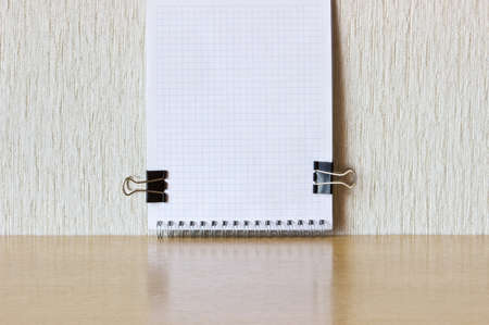 Checked notebook with paper clipsの写真素材