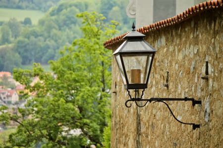 Street lantern on the stone wallの写真素材