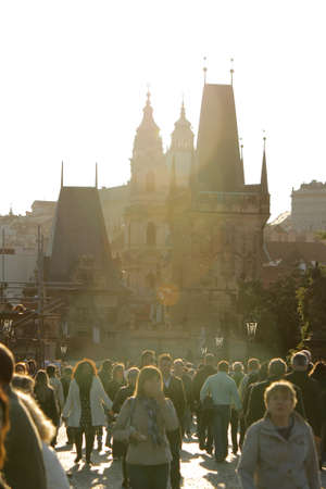 Tourists walking along Charles Bridge at sunset. Vertical imageのeditorial素材