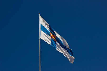 Flag of Finland on background blue skyの写真素材