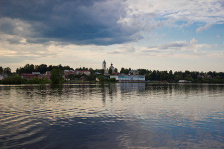 Cityscape of province town. View from river at sunsetの写真素材