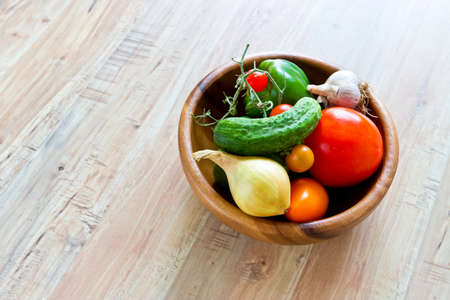 Fresh vegetables in wooden bowlの写真素材