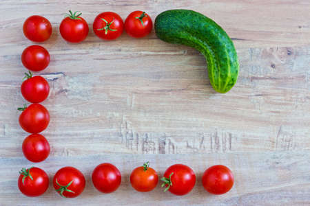 Fresh vegetable frame: tomatoes and cucumberの写真素材