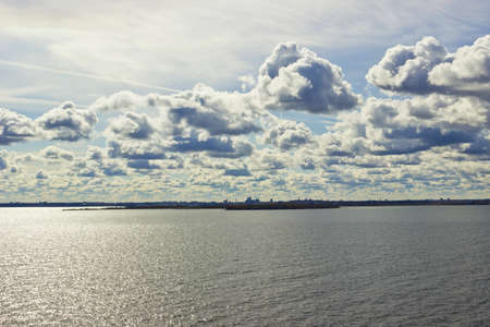 Panoramic skyline of Tallinn and harbor with beautiful cloudy sky at sunrise, Estoniaの写真素材