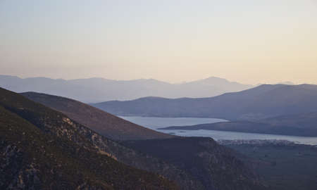 Landscape with mountains and blue waters of the Gulf of Corinth, Greece. Sunsetの写真素材