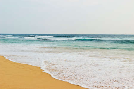 Sea surf on the beachの写真素材