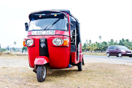 Red empty tuk-tuk waits for passengers. Galle, Sri lankaのeditorial素材