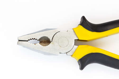 Pliers black and yellow tool on white background close upの写真素材