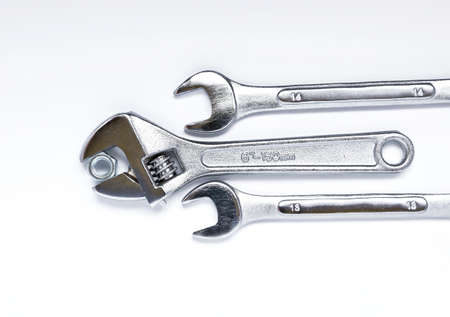 Spanner with nut and wrench tool isolated on white backgroundの写真素材
