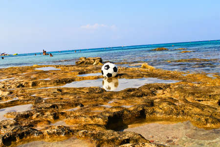 Soccer ball on the beachの写真素材