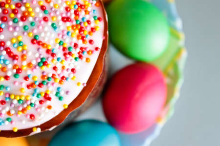 Easter cake and painted eggs closeup. Focus on cakeの写真素材