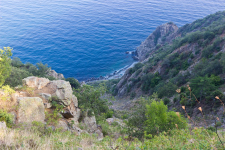 Rocky coastline with wild beach. Sunset. Crimea