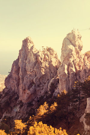 High rocks Ai-Petri of Crimean mountains. Black sea coast and blue sky with clouds. Russia. Image...