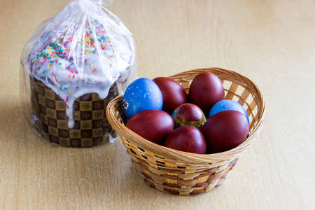 Colored easter eggs and easter cakeの写真素材