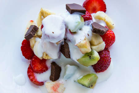 Fruit salad with chocolate and yougurtの写真素材