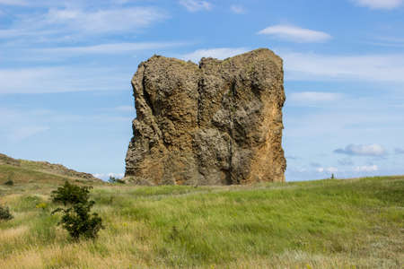 Large cube stone on hillの写真素材