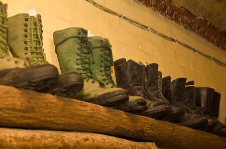 world war II military boots on wooden display shelfのeditorial素材
